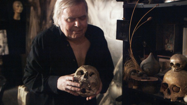 Giger holding his first human skull. It was a gift from his father when Giger was only six. In the film, Giger explains that he would drag the skull down the street by a string.